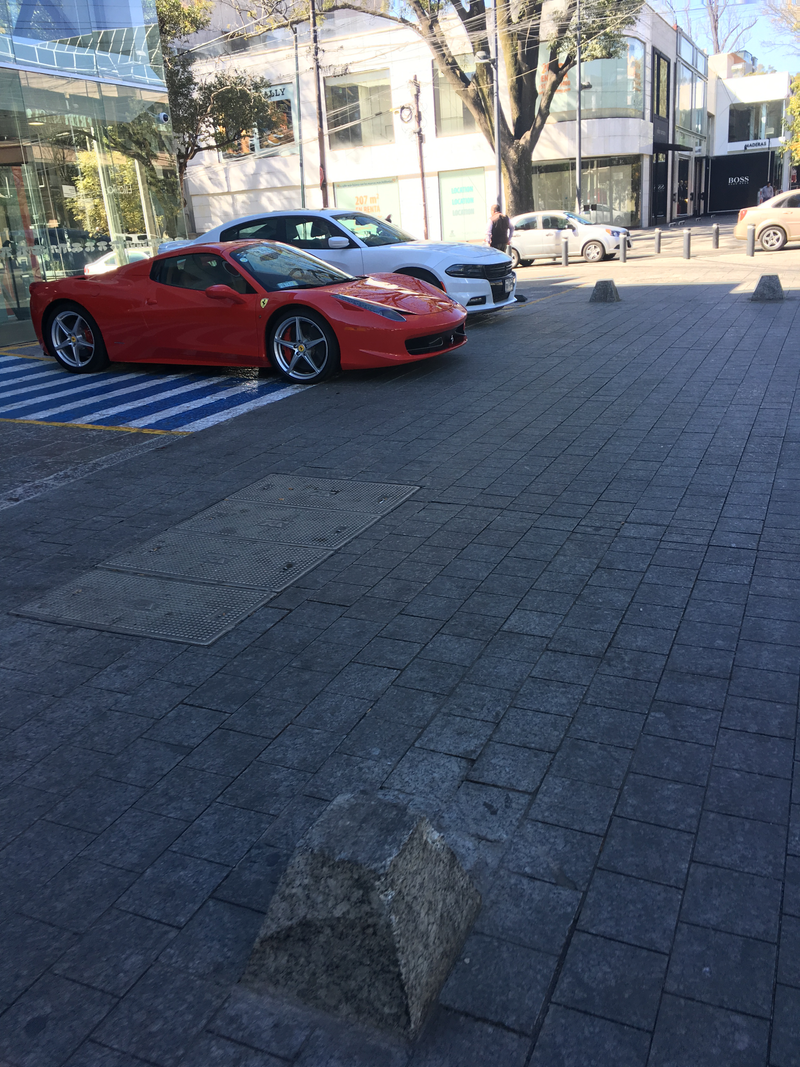 458 spyder next to a Dodge charger with the PPV package (probably body guards) Notice how the Ferrari has both the road tags AND the front license plate taped to the windshield